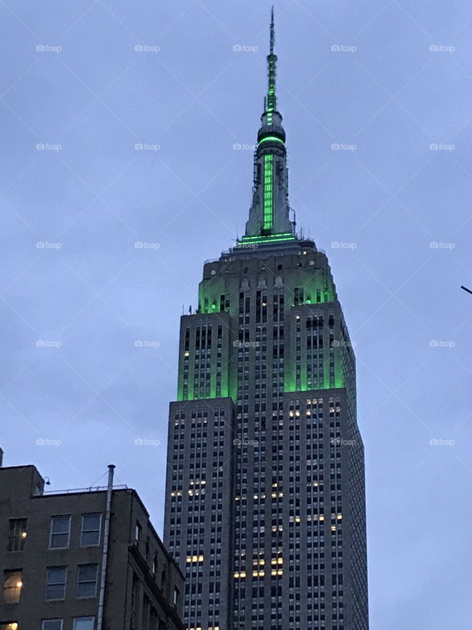 Empire State Building in New York lit up in green