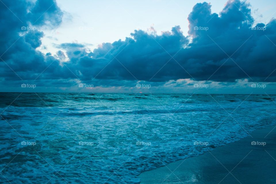 Blue clouds over ocean