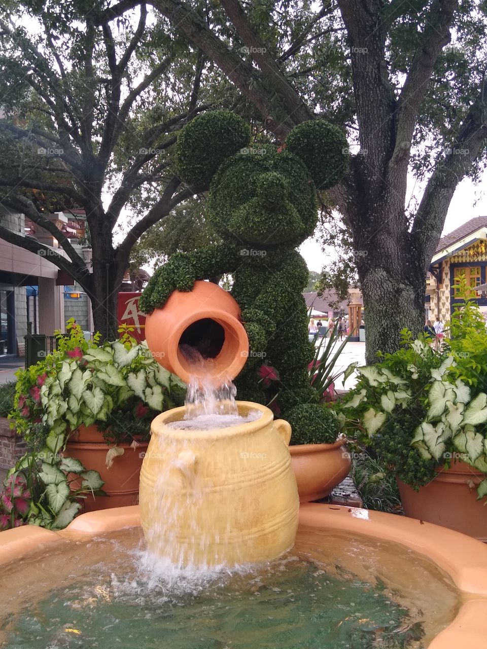 Close up of Mickey Mouse on top of his fountain