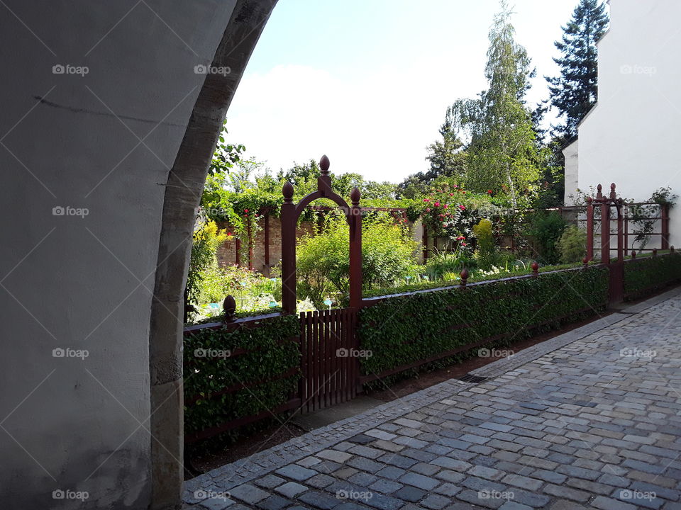 First view on a beautiful garden in a medieval castle