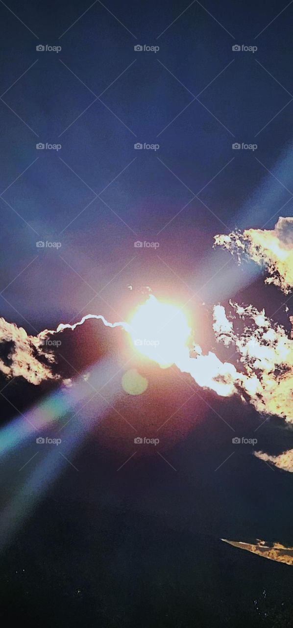 Sun breaks thru clouds