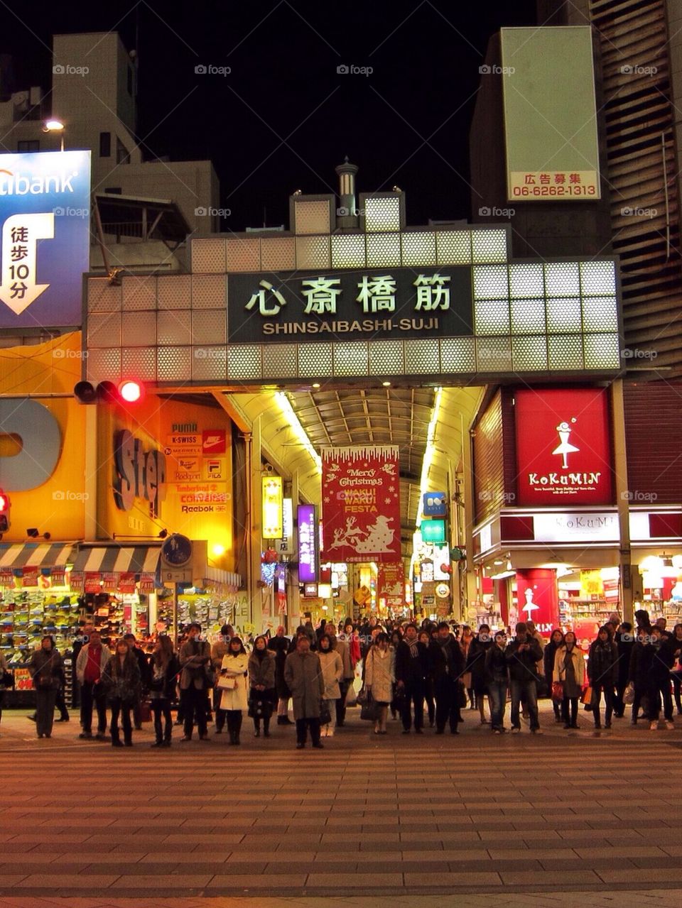 The crowd waits to cross