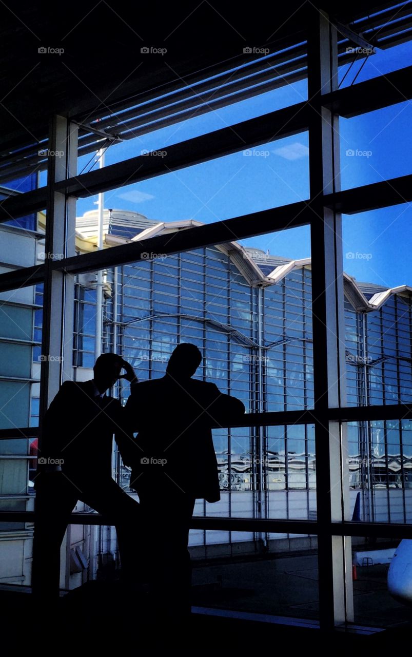 Men talk in Ronald Reagan Washington DC international airport 