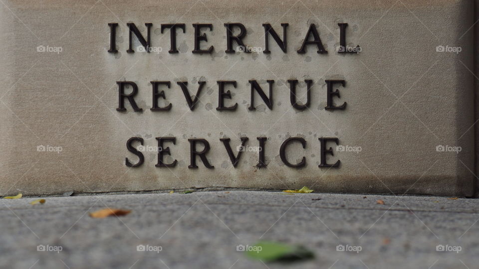 IRS Internal Revenue Service sign stone building tax taxpayer