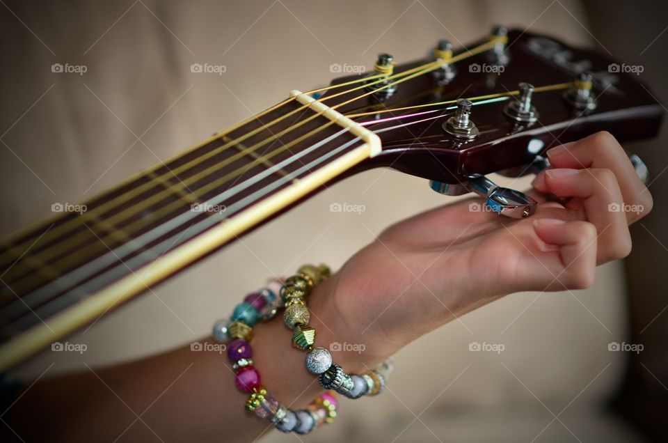 Young female guitar player