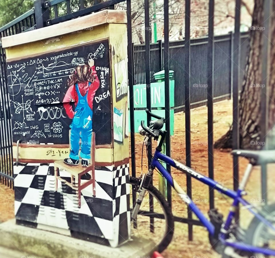 Girl writing on Chalk Board