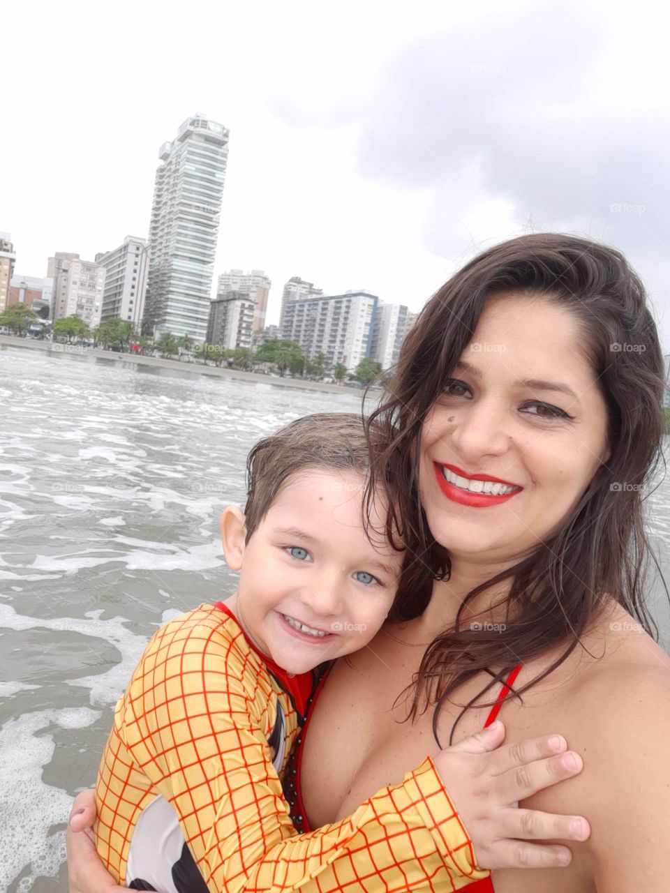 mother and son enjoying the beach in Santos