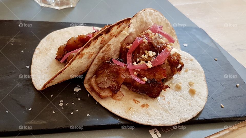 tacos from valencia stuffed with pork and vegetables