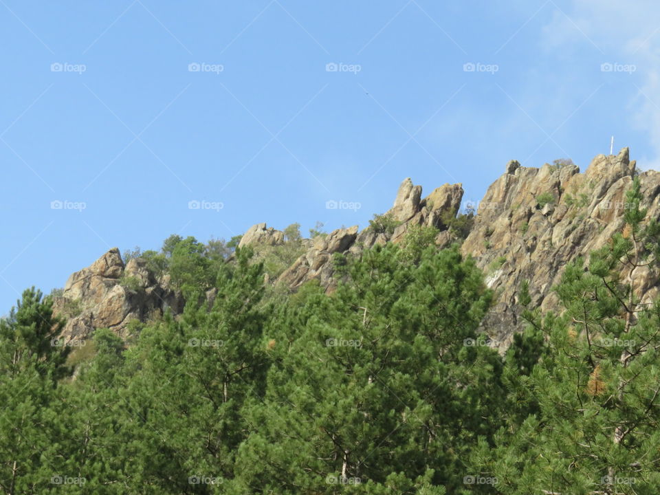 Sharp rocky peaks with dense forest