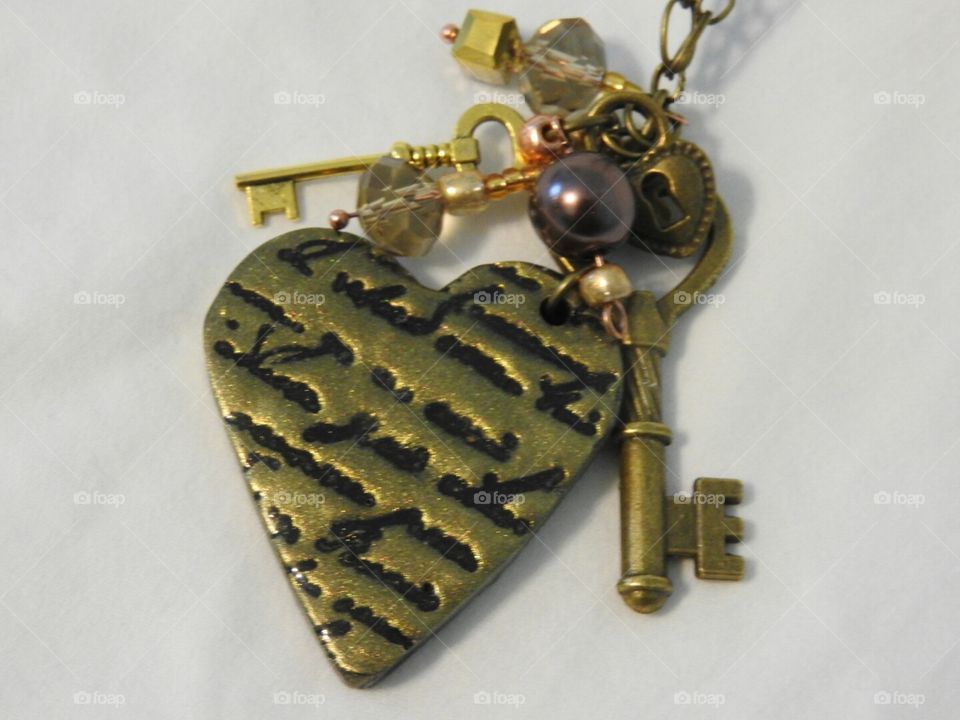 Mixed media polymer clay heart pendant necklace by Robin's Nest Designs.