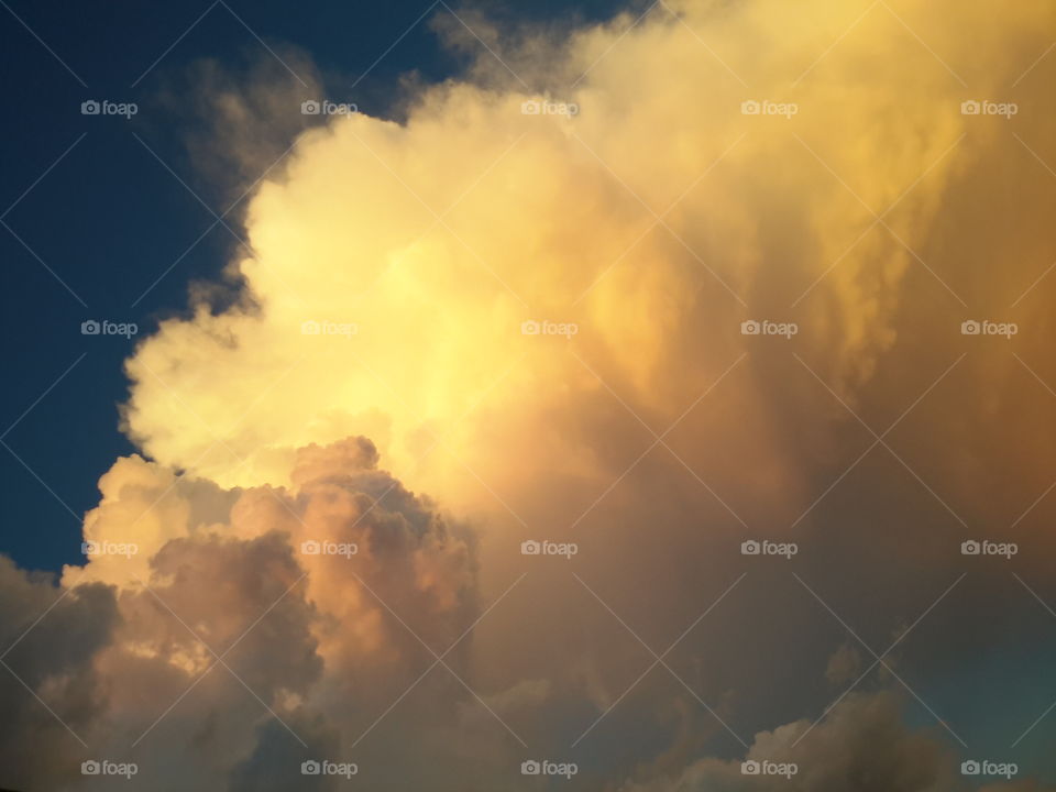 sunlit clouds. Clouds lit by setting sun