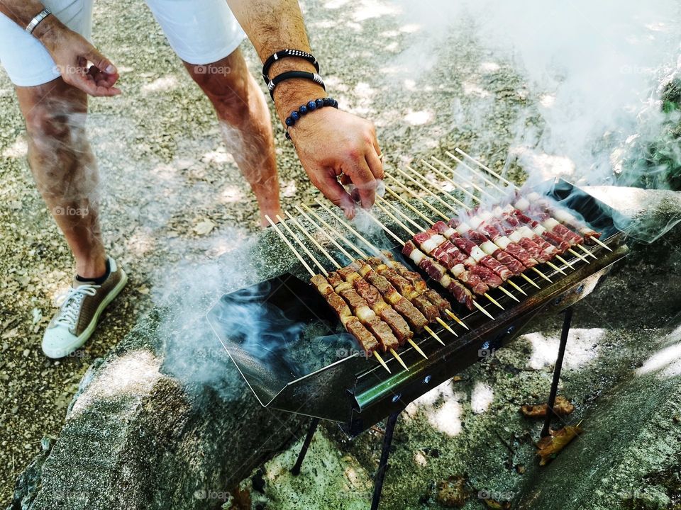 skewers of Abruzzo arrosticini cooked on the grill