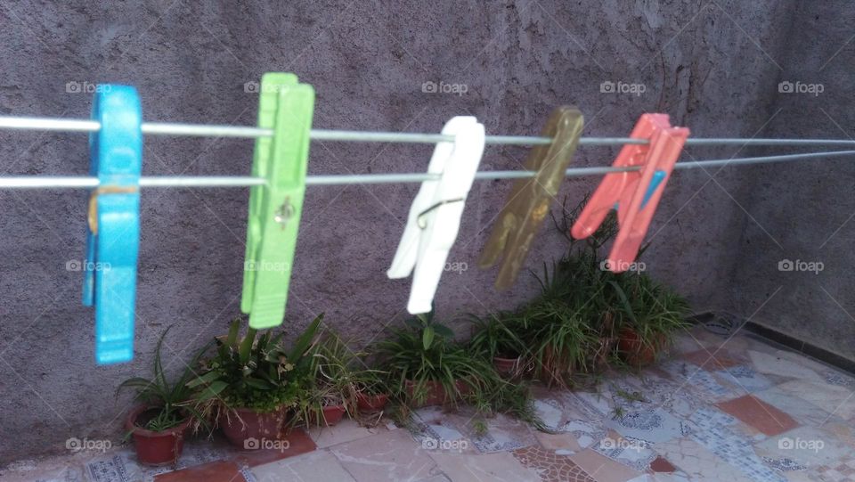 Colored handles hanging in wires.