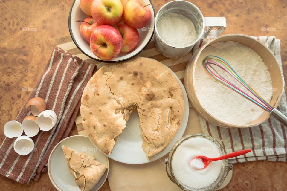 Making homemade puffed apple pie with eggs, sugar and flour.