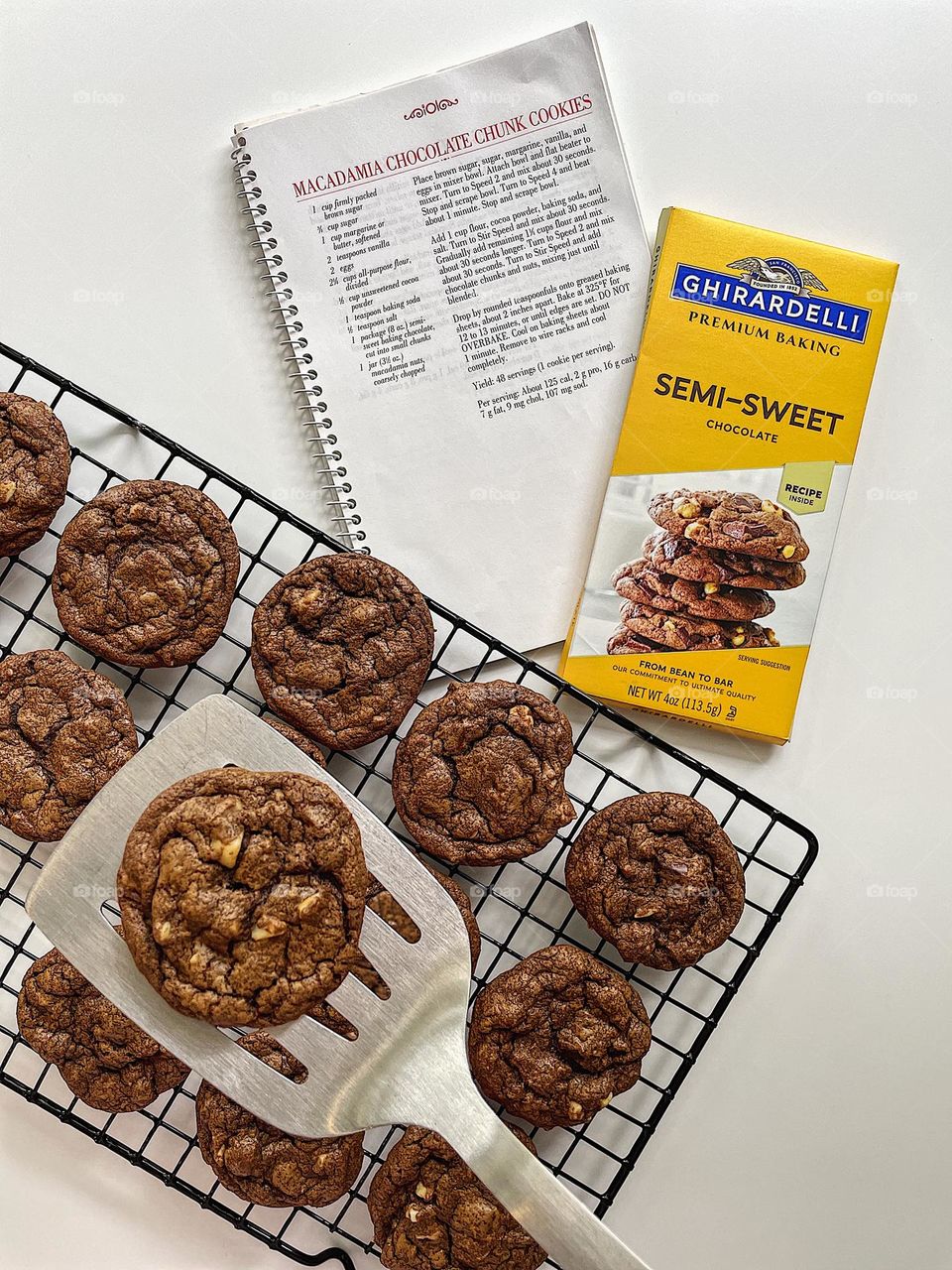 Making cookies at home, putting cookies onto a cooling rack with a spatula, making macadamia chocolate chunk cookies, homemade cookies from scratch, baking with toddlers 