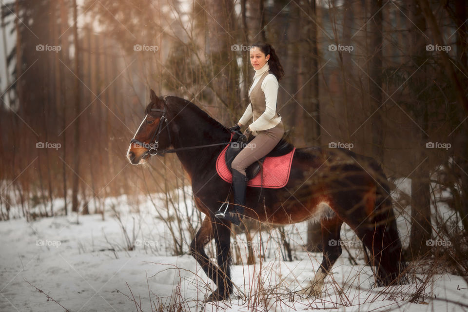 Young beautiful woman with horse outdoor portrait at spring day