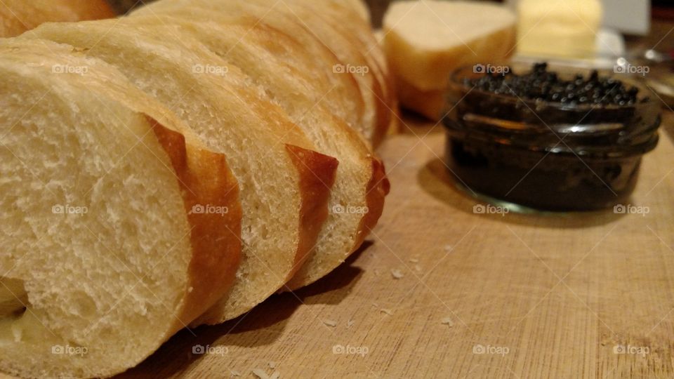 Bread, butter, and black caviar.