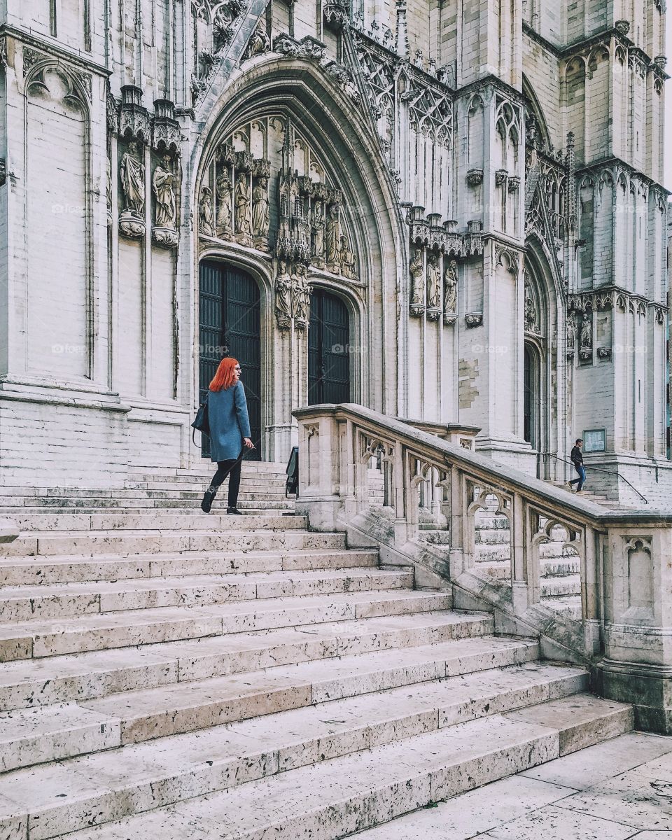 Redhead and tinyman around the cathedral
