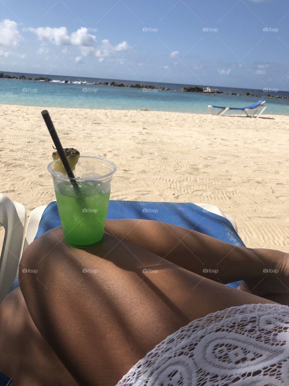 Enjoying a refreshing cocktail on a perfect summer beach day!
