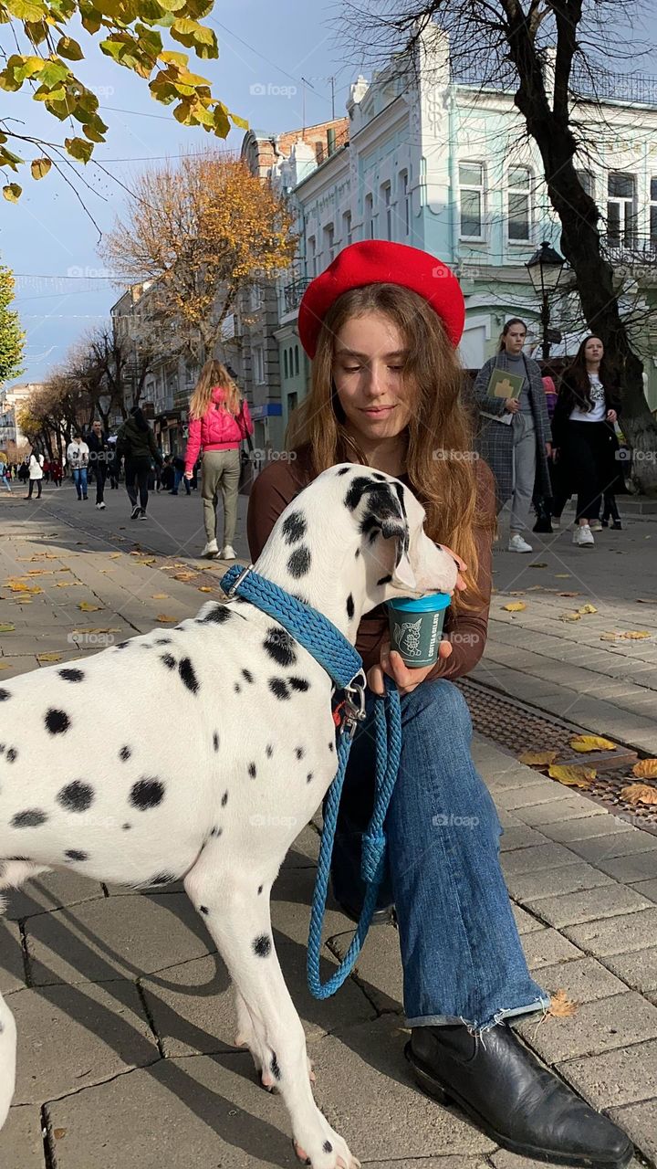 Summer in the city with puppy Dalmatian 