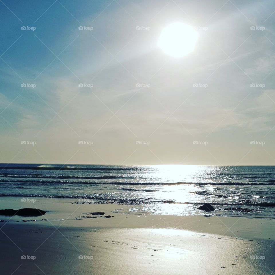 Calming sunset walks on the beach. Beautiful pastel  colors