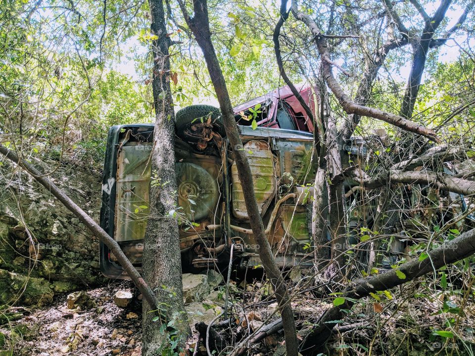 Car graveyards in the middle of the woods