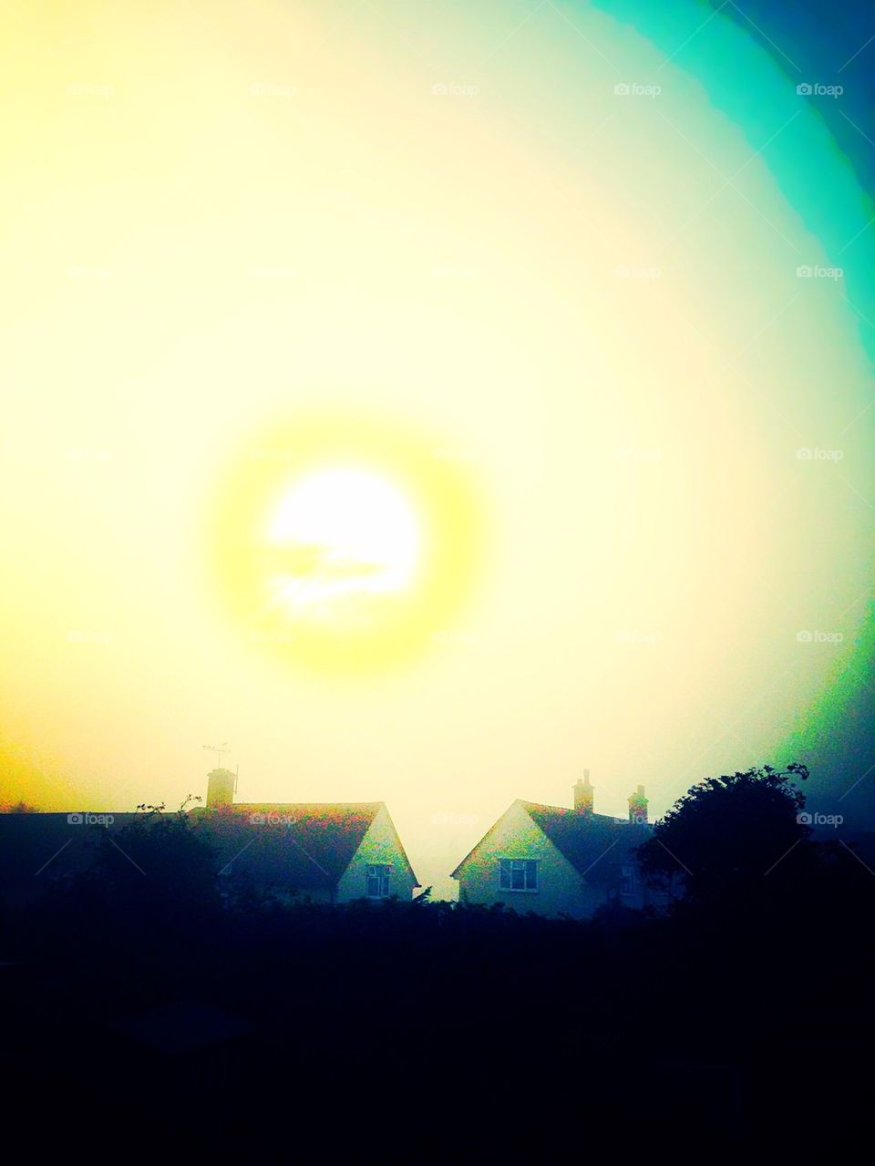 Bright Sun over houses