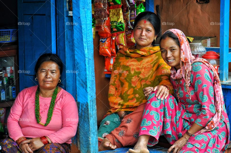 Female friends sitting in shop