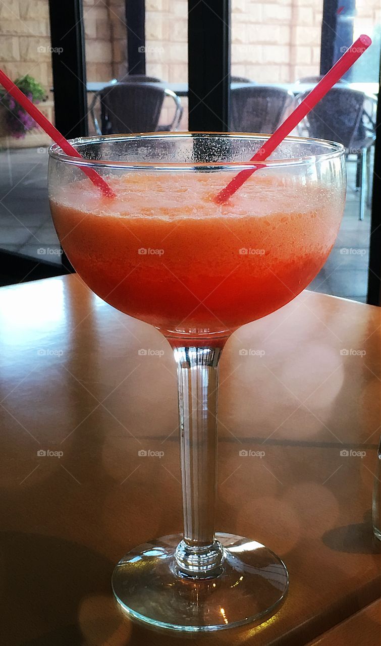 Giant strawberry daiquiri, fruity alcoholic beverage