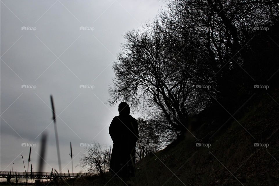 a girl was watching the sunset on a farm in the North of Iran