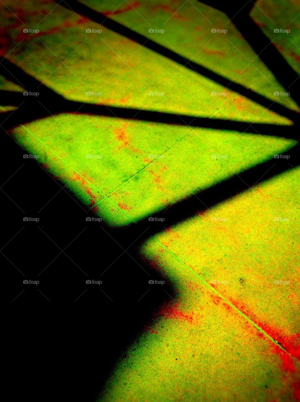 Blue window at twilight. Rust stains on sidewalk. 