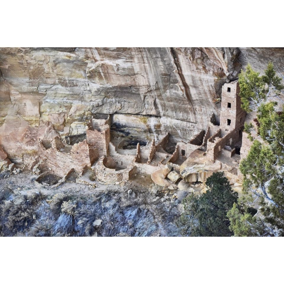 Cliff dwellings in Mesa Verde National Park on a snowy winter day. These ancient ruins were made by the Anasazi people of the southwest. Square house.