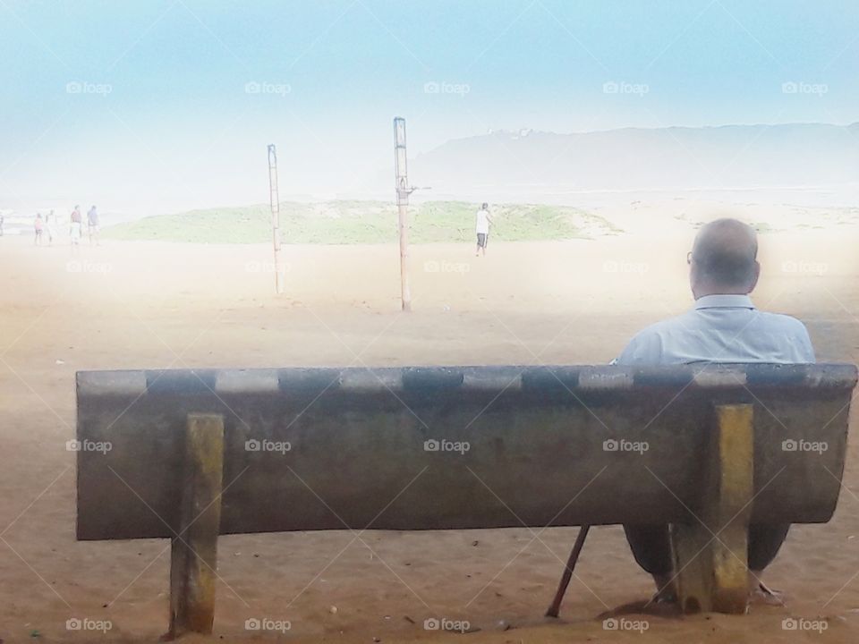 Foggy Morning with old man enjoying the view of people in the fog