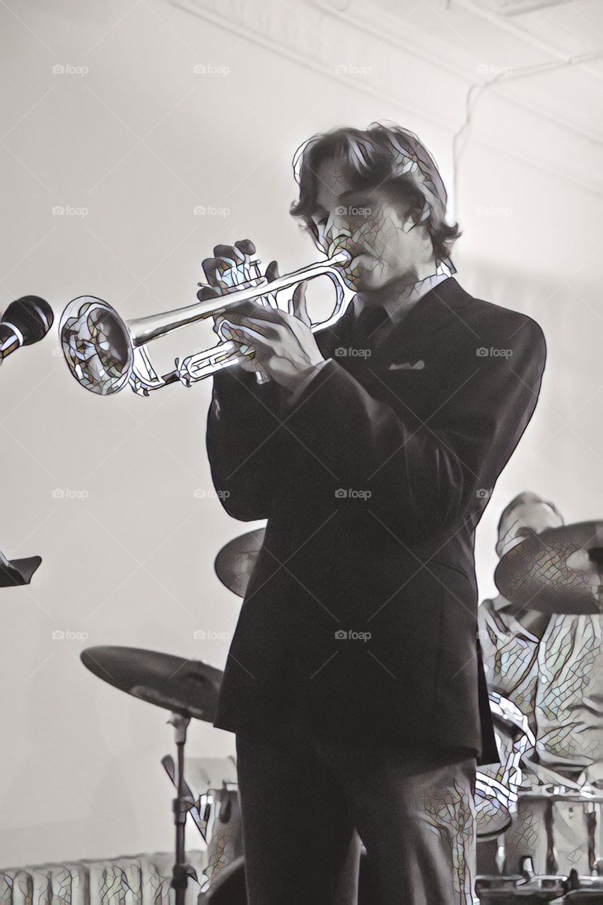 Musician, dynamic black-and-white portrait of trumpet player performing