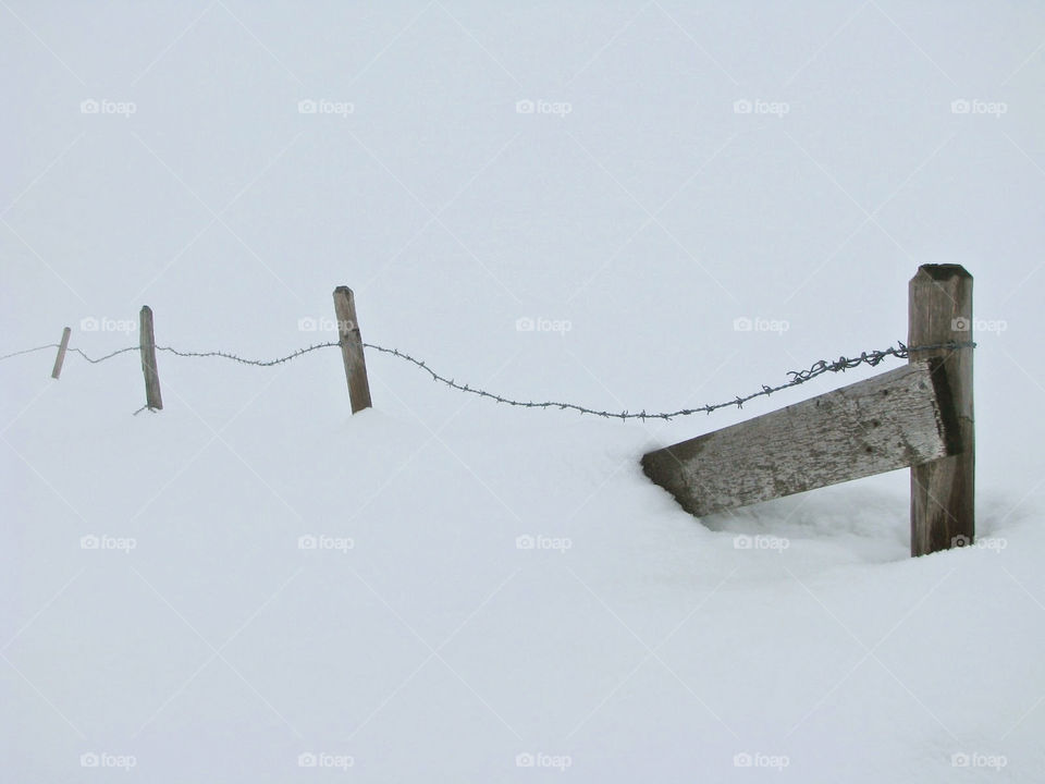 Fence covered in snow, Switzerland