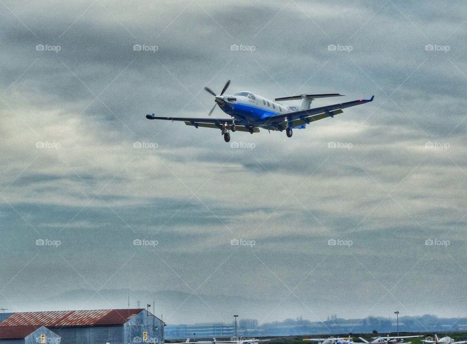 Single Engine Aircraft Landing. Airplane With Lowered Flaps On Final Approach To Airport