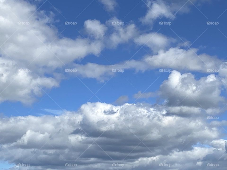 True Blue summer sky with white puffy clouds. Taken on a beautiful summer day in Point Pleasant Beach, NJ. 