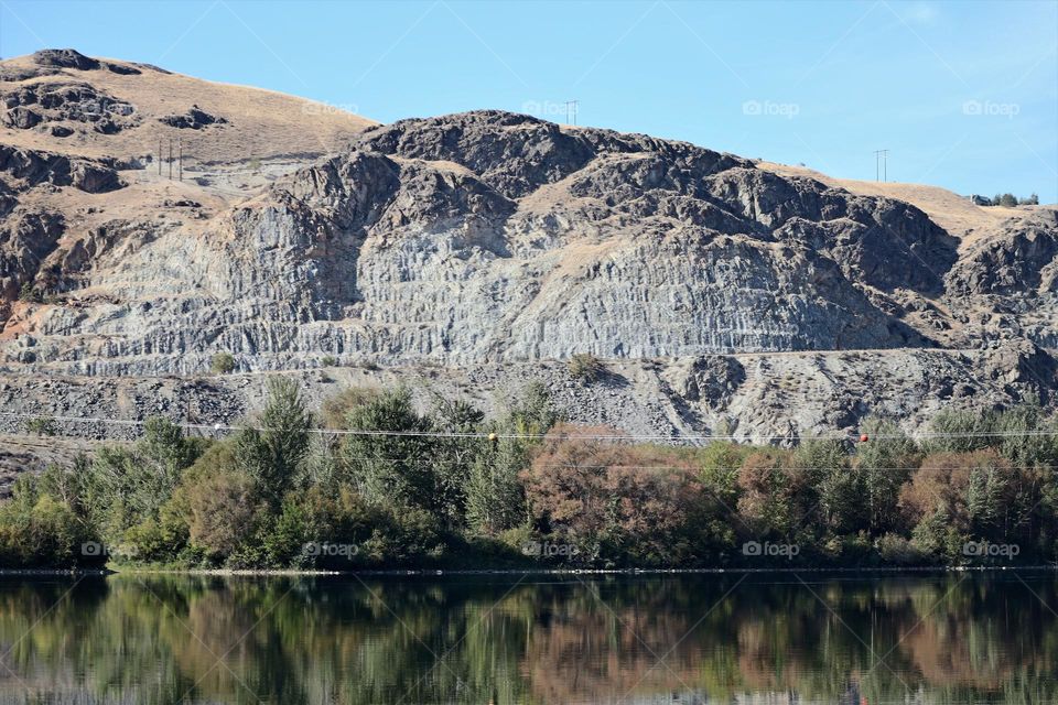 Rocky hillside reflection