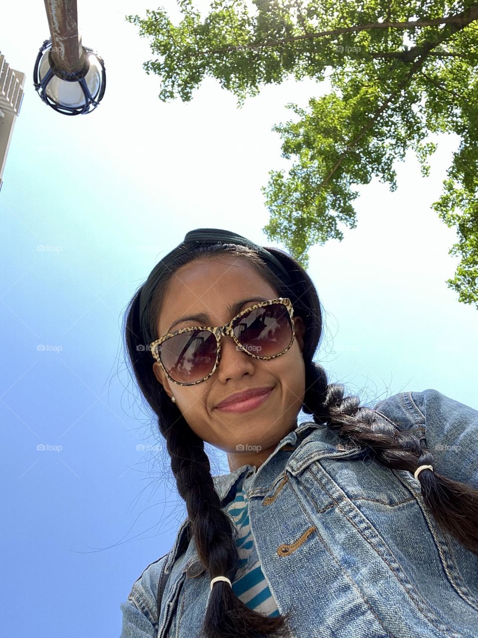 A woman’s selfie against blue sky