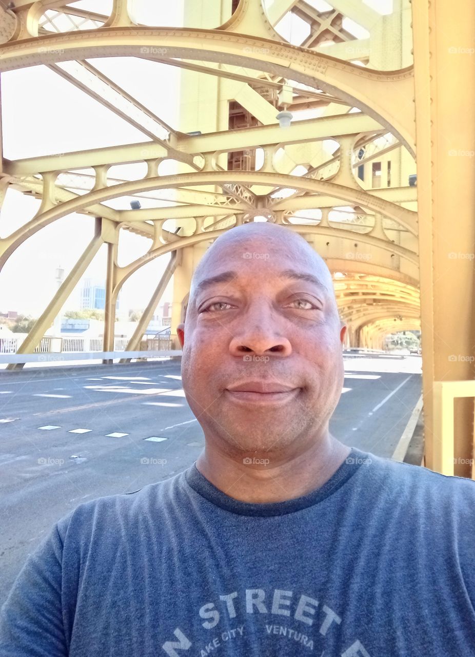 selfie, walking across the Golden bridge in Sacramento California.