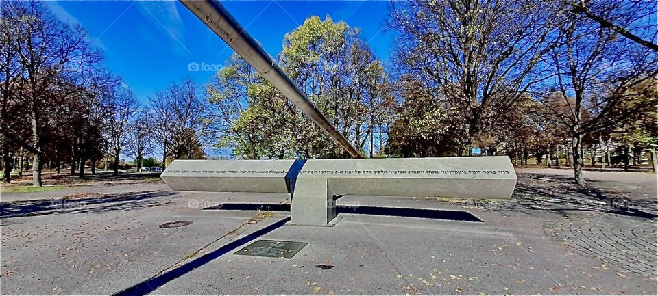 A passage through one of the modern art inspired abstract futuristic design structures made from monumental silvery metal at the stadium site for the 1972 „Olympics“ in „Munich“, Germany. 2022. Hypnotic Productions