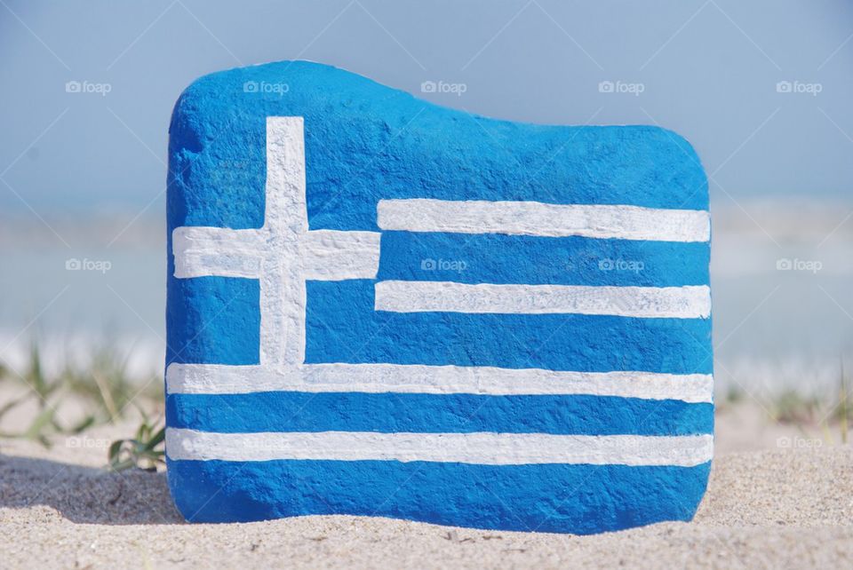 Greece national flag colours on a stone