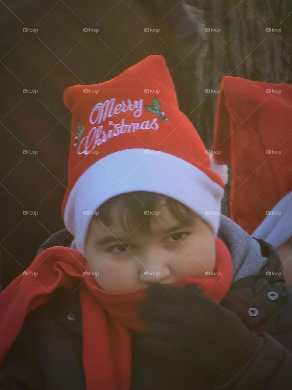 child with christmas hat