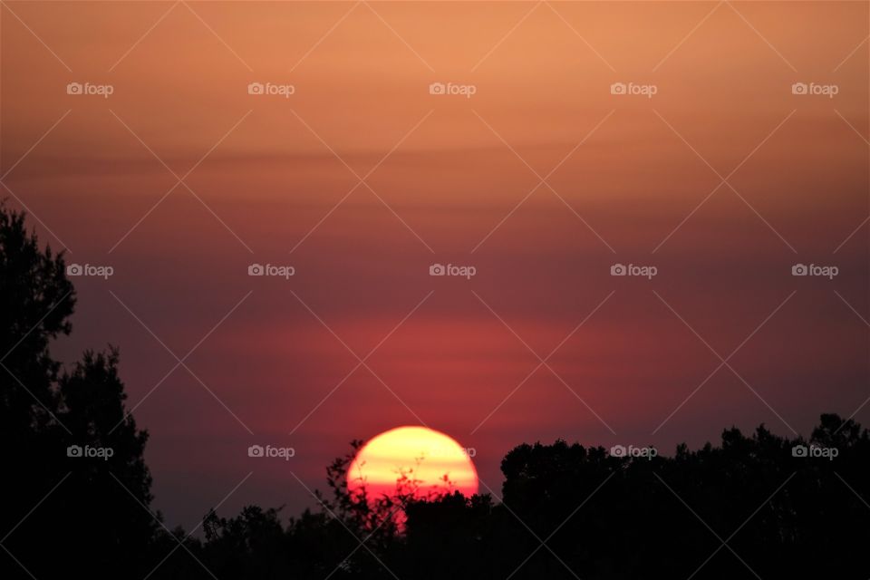 Smoke from a distant fire makes for a spectacular sunset