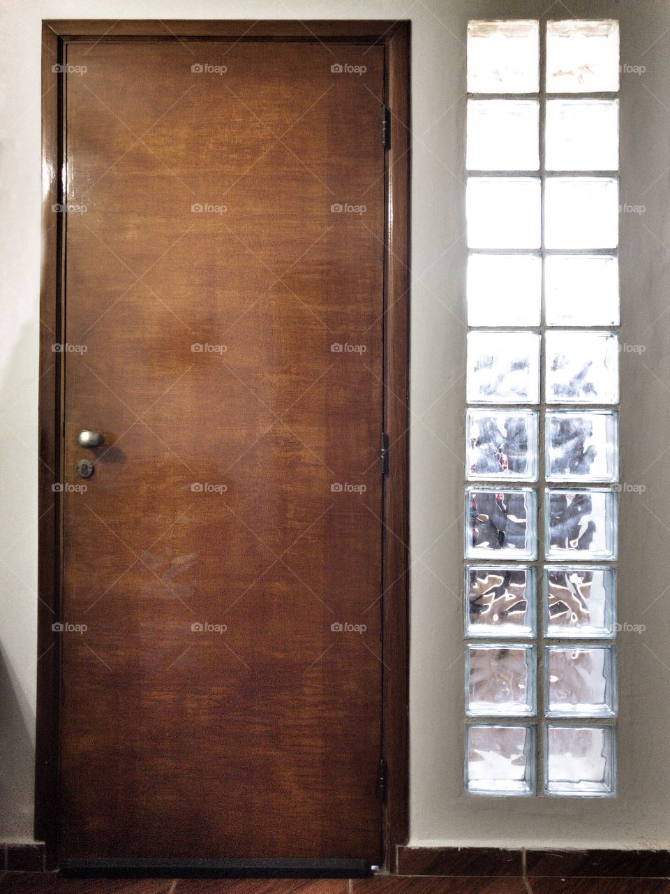 Shapes are everywhere... you just need to look with new eyes... a simple door with glass brick wall by its side is a good example of rectangles and squares, side by side.