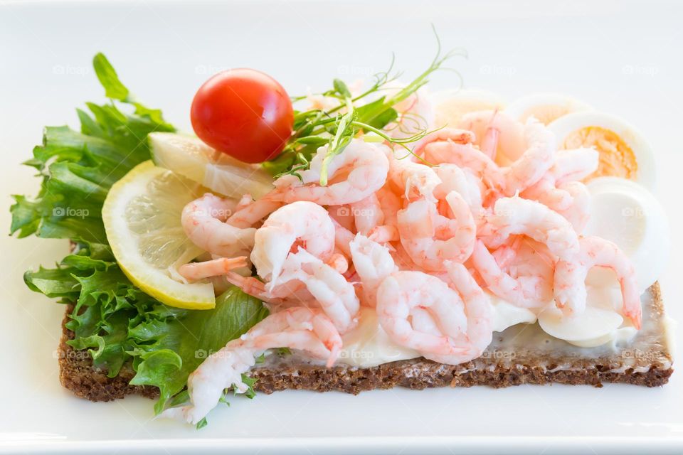 Delicious Swedish Landgång , bread with shrimps, egg, vegetables and mayonnaise 