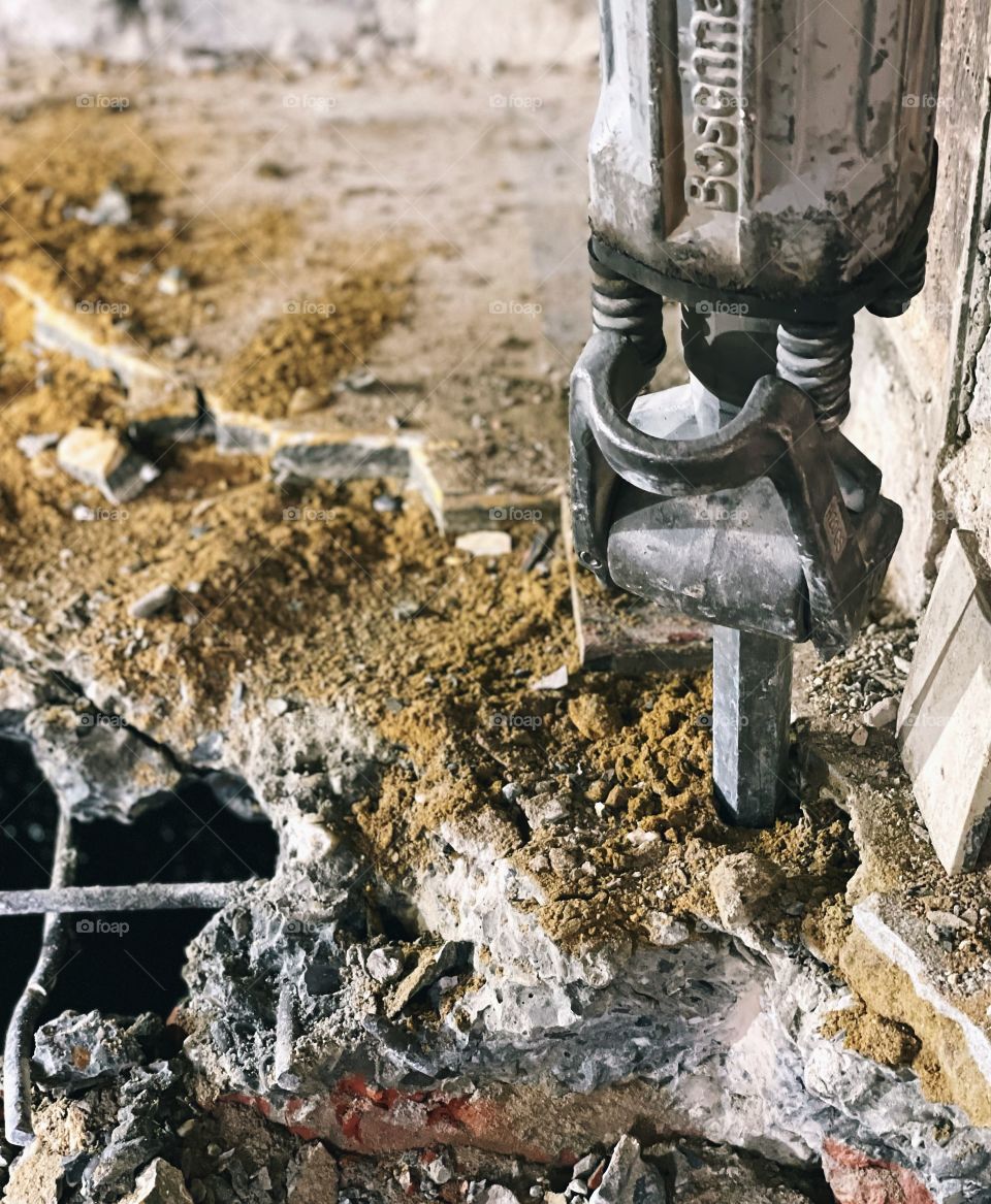 Drill hammer in concrete on a construction site 