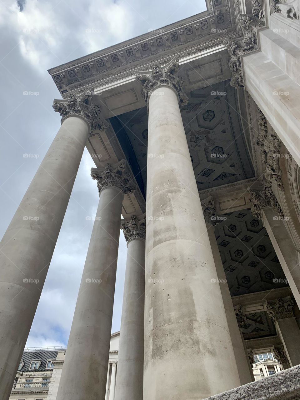 Low angle view of classic style building architecture with romanic columns, London 