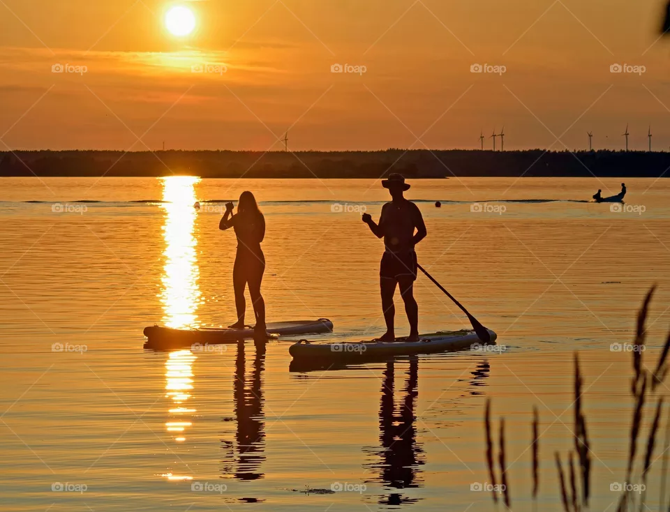 Stand up paddling in the sunset