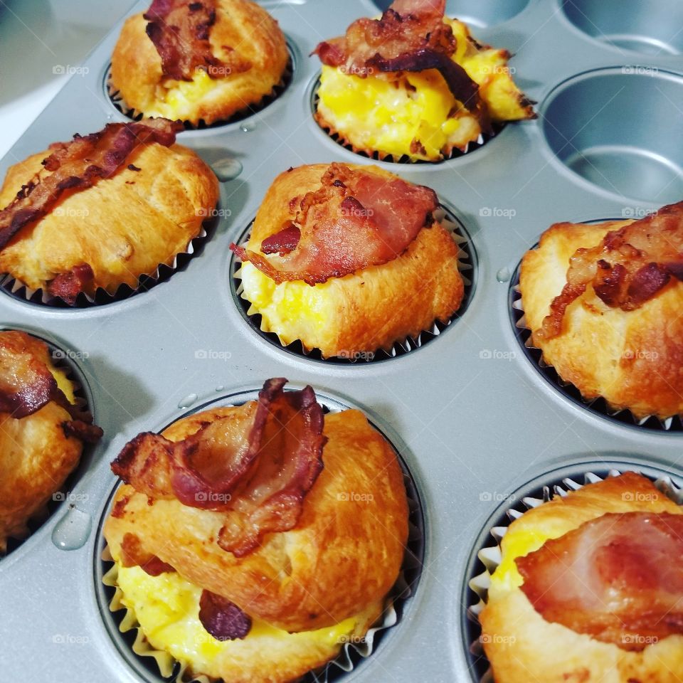 Breakfast cupcakes! pillsbury dough, scrambled eggs, shredded cheese mix and bacon. Oven-baked!